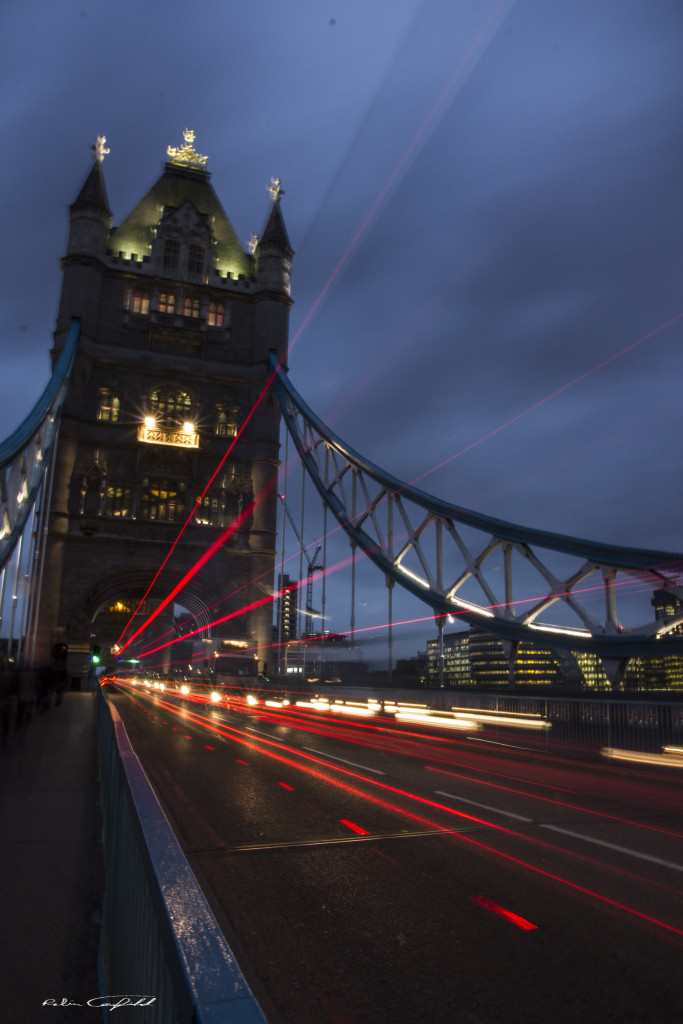 Traffic on the Tower Bridge crossing the Thames.  London, UK