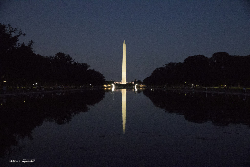 The monument on the reflecting pool by night. Washington, D.C. - August, 2015